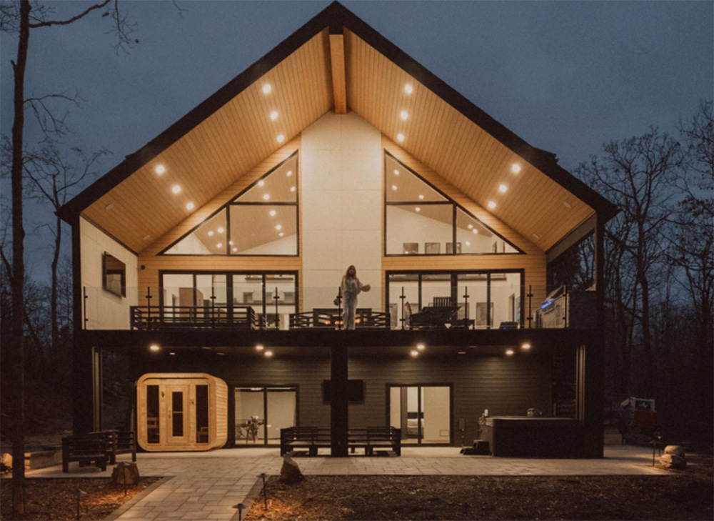 Modern log cabin retreat exterior at dusk