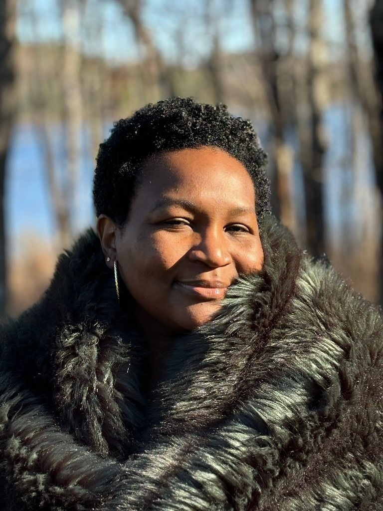 Guest wrapped in a fur throw outdoors