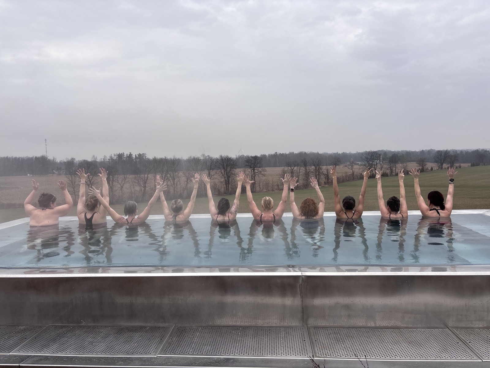 Group cheering in the infinity pool