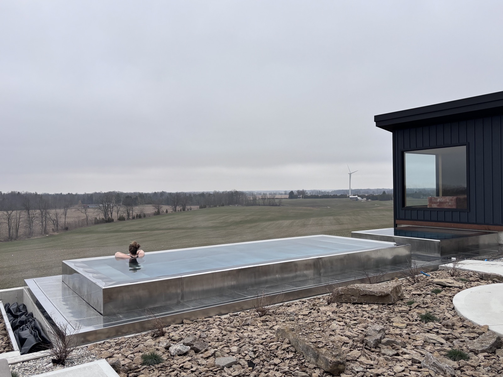 Solo plunge pool overlooking open fields